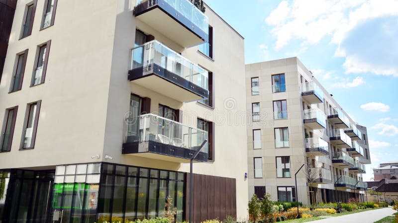 Modern apartment building in Srodmiescie district on a sunny day with a blue sky. Facade of a modern apartment.