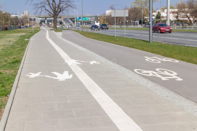 WARSAW, POLAND - FEBRUARY 6, 2019: Empty bicycle lane next to sidewalk. Convenient way of urban transport. - Image