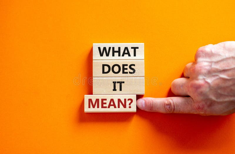 What does it mean symbol. Wooden blocks with words `What does it mean`. Beautiful orange background, male hand. Copy space. Business and what does it mean concept. What does it mean symbol. Wooden blocks with words `What does it mean`. Beautiful orange background, male hand. Copy space. Business and what does it mean concept.