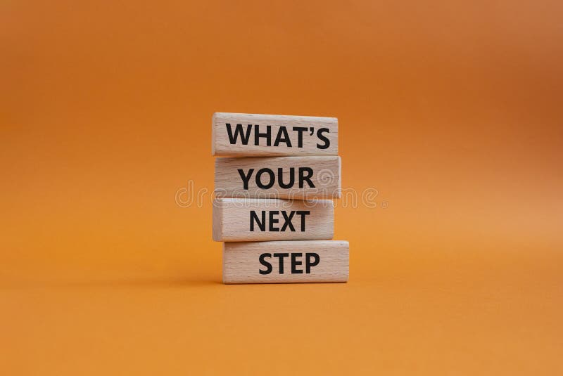 What is your next step symbol. Wooden blocks with words What is your next step. Beautiful orange background. Business concept. Copy space. What is your next step symbol. Wooden blocks with words What is your next step. Beautiful orange background. Business concept. Copy space