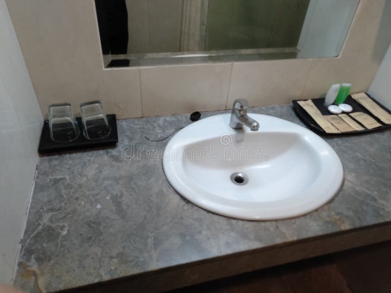 Wash basin hotel amenities editorial stock photo. Image of tile 262147673