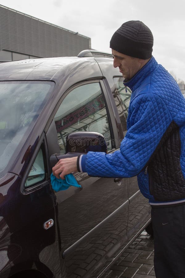 Wash the car mirror stock image. Image of wipe, water 65496713