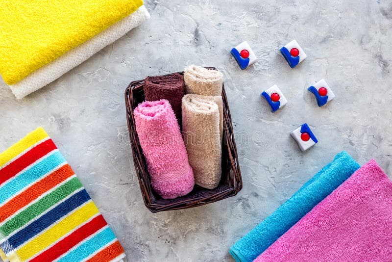Wash Clothes. Clean Towel and Detergent on Grey Stone Background Top