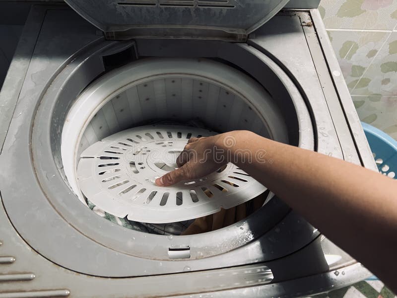 Washing Clothes, Spinning Clothes in the Dry Cleaning Tank in the Old
