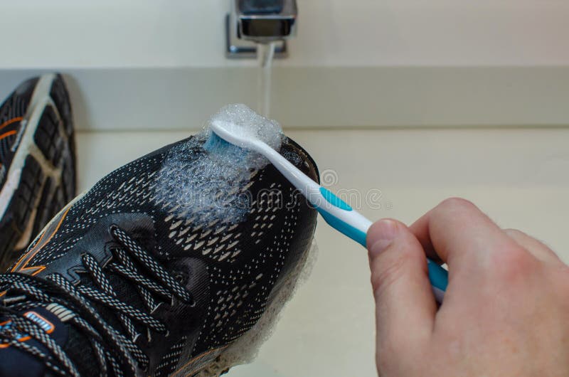 Washing the Dirty Sneakers. Cleaning Running Shoe Outsoles. Stock Image ...