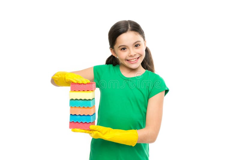 Washing the dishes is my job. Small housekeeper holding dish sponges in rubber gloves. Little housemaid ready for