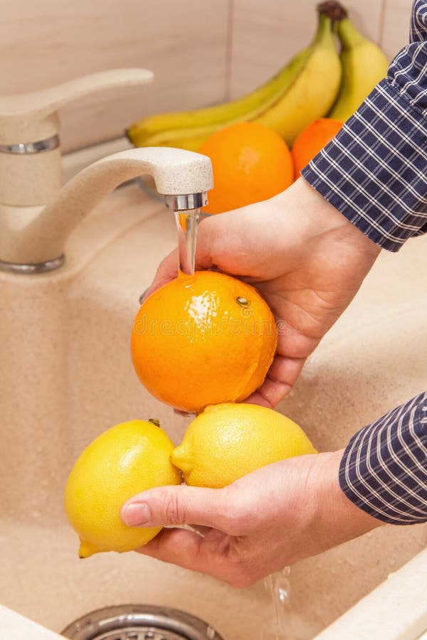 Washing Fruits in the Sink. Hands Washing Orange and Lemon Stock Photo Image of home, diet