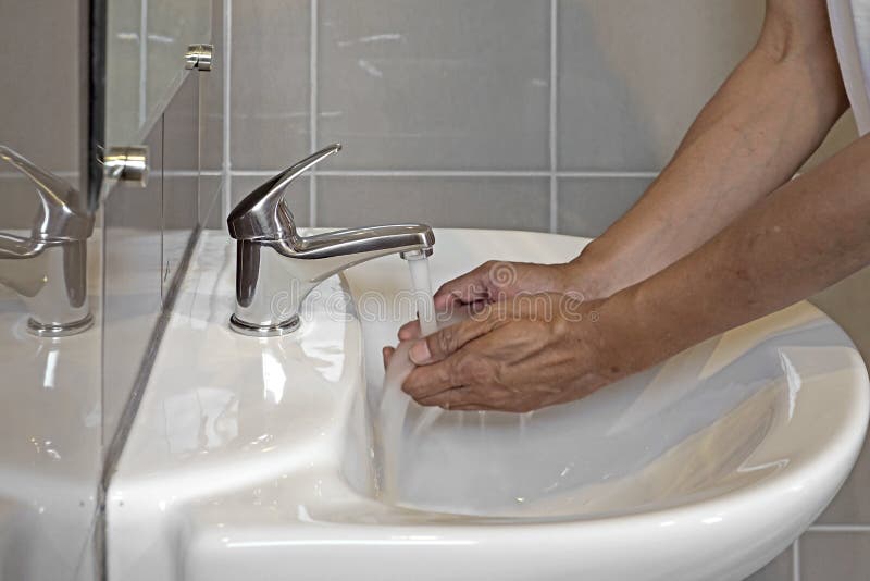 Washing Hands in Bathroom Sink Stock Photo Image of bathroom, home