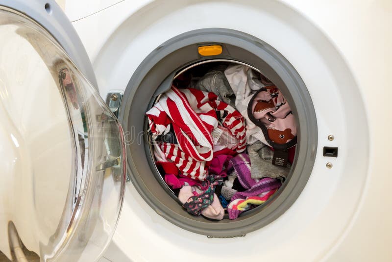 Washing Machine Full Of Dirty Laundry Stock Photo - Image ...