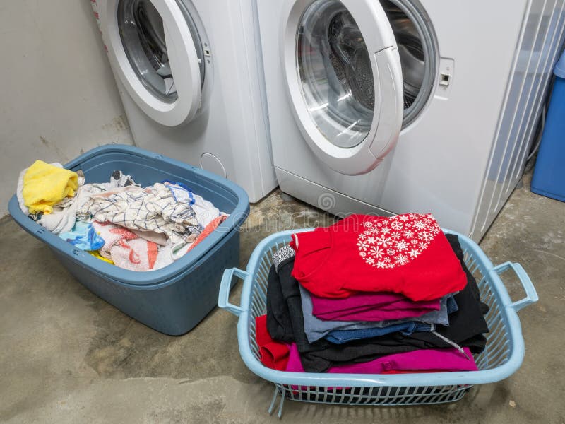 Washing Machine in Laundry Room with Laundry Baskets Stock Photo