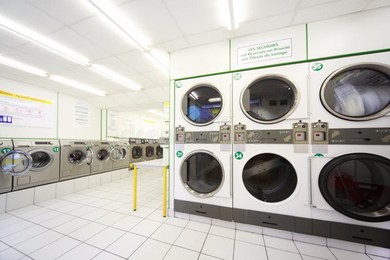 Washing machines in empty public laundry royalty free stock photo