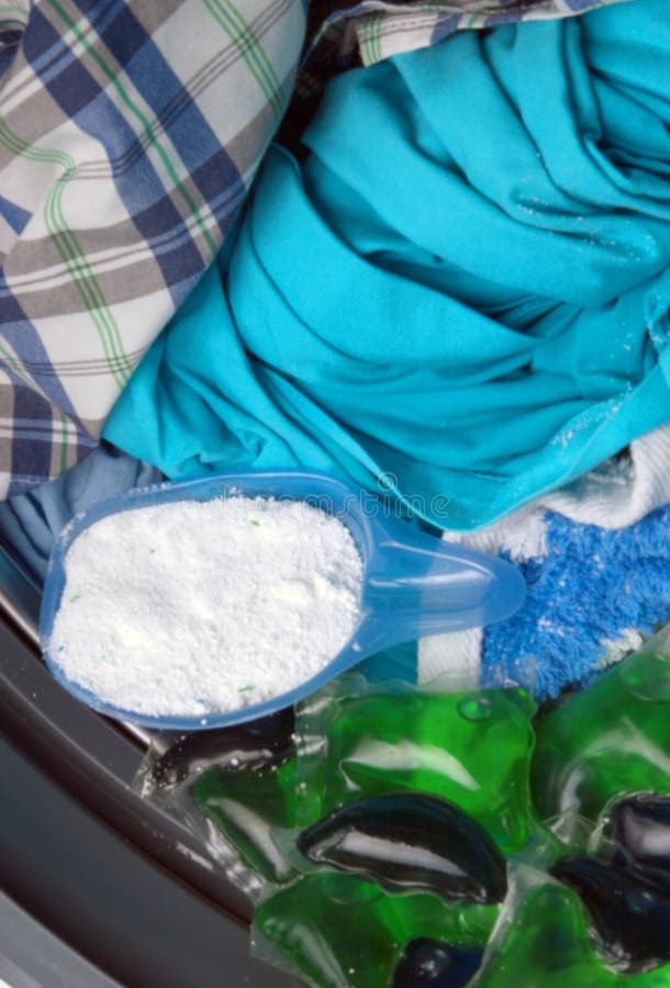 https://thumbs.dreamstime.com/b/washing-powder-measuring-cup-gel-capsules-laundry-top-view-detergent-machine-219233930.jpg