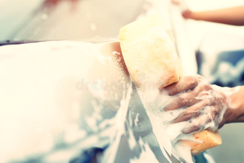 Outdoor car wash with active foam soap. commercial cleaning washing service  concept. Leave space to write messages. Stock Photo