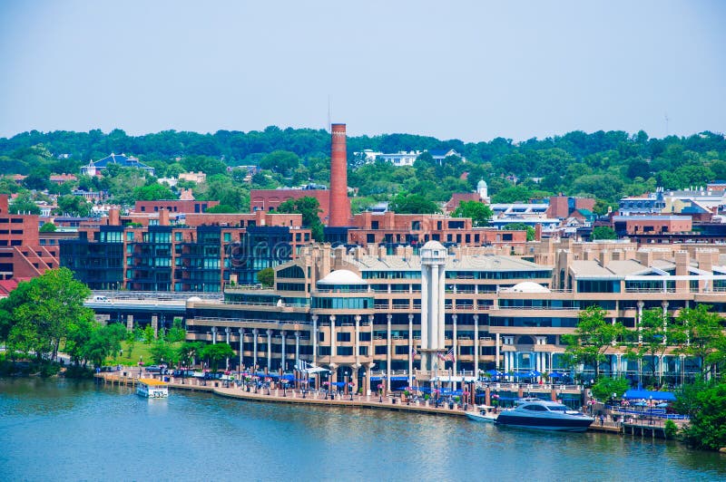 Washington DC by the Potomac river, elevated view of Washington DC by the Potomac river. In the picture are Key bridge, and Georgetown waterfront park and harbor. Washington DC by the Potomac river, elevated view of Washington DC by the Potomac river. In the picture are Key bridge, and Georgetown waterfront park and harbor.