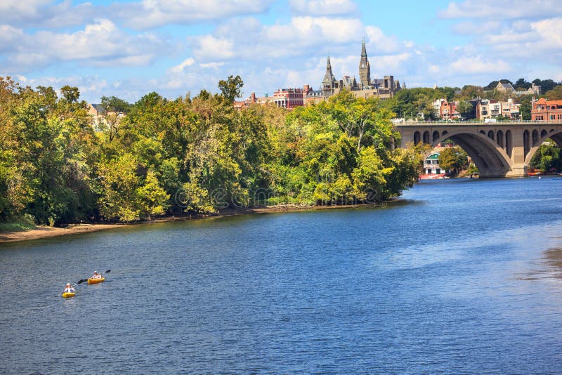 Key Bridge Potomac River Kayaks Georgetown University Washington DC from Roosevelt Island. Completed in 1923 this is the oldest bridge in Washington DC. Key Bridge Potomac River Kayaks Georgetown University Washington DC from Roosevelt Island. Completed in 1923 this is the oldest bridge in Washington DC.