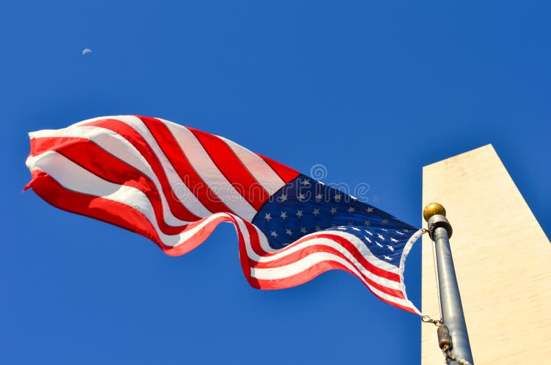 Washington DC, Washington Monument and US Flag in a Clear Sky Stock