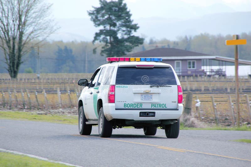 Washington State Border Patrol. Rear view of a Washington State border patrol vehicle patrolling the Canadian and Washington border stock photo Washington State Border Patrol. Rear view of a Washington State border patrol vehicle patrolling the Canadian and Washington border stock photo