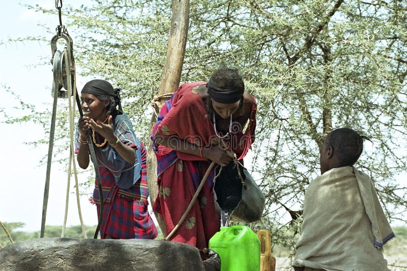 Ethiopia, Afar region: The Afar, an ethnic group of semi-nomadic cattle farmers in the are affected by of an impending famine by drought, climate change and massive death of their livestock. The scarcity of water, drinking water, is huge and women have to walk for hours to come to a water source. These women and a boy fetch water from a well. However, the water level is lowered so that the water pump stops working and they need ropes, buckets and pulley from the depths can still get some drinking water upwards. This work they perform in the scorching heat of the Danakil Desert. They fetch water with colorful jugs. Due to global warming and El Nino the region is plagued by persistent drought, droughts. Ethiopia, Afar region: The Afar, an ethnic group of semi-nomadic cattle farmers in the are affected by of an impending famine by drought, climate change and massive death of their livestock. The scarcity of water, drinking water, is huge and women have to walk for hours to come to a water source. These women and a boy fetch water from a well. However, the water level is lowered so that the water pump stops working and they need ropes, buckets and pulley from the depths can still get some drinking water upwards. This work they perform in the scorching heat of the Danakil Desert. They fetch water with colorful jugs. Due to global warming and El Nino the region is plagued by persistent drought, droughts.