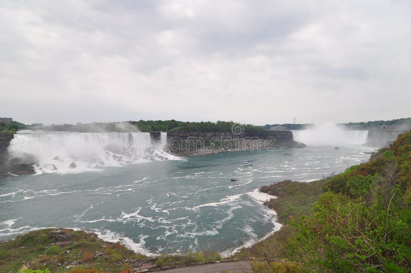 Water falls on the Niagara river. The Niagara River is a river that flows north from Lake Erie to Lake Ontario. It forms part of the border between the Province of Ontario in Canada (on the west) and New York State in the United States. The river is about 56 kilometres (35 mi) long and includes Niagara Falls in its course. Water falls on the Niagara river. The Niagara River is a river that flows north from Lake Erie to Lake Ontario. It forms part of the border between the Province of Ontario in Canada (on the west) and New York State in the United States. The river is about 56 kilometres (35 mi) long and includes Niagara Falls in its course.