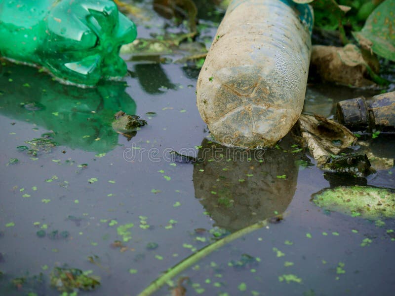 Material Plastic Pollution Presented on Gutter Water, Dirty Polluted