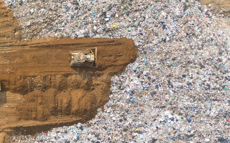 Waste disposal pile of plastic garbage and various trash aerial view by drone.recycling and disposal junk construction.Pollution stock photography Waste disposal pile of plastic garbage and various trash aerial view by drone.recycling and disposal junk construction.Pollution stock photography
