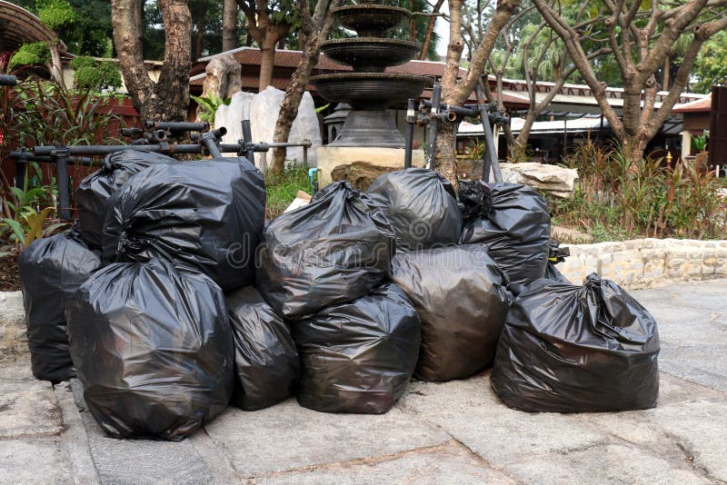 Waste Lots Pile of Garbage Black Bags Plastic Stack on the Floor Ground