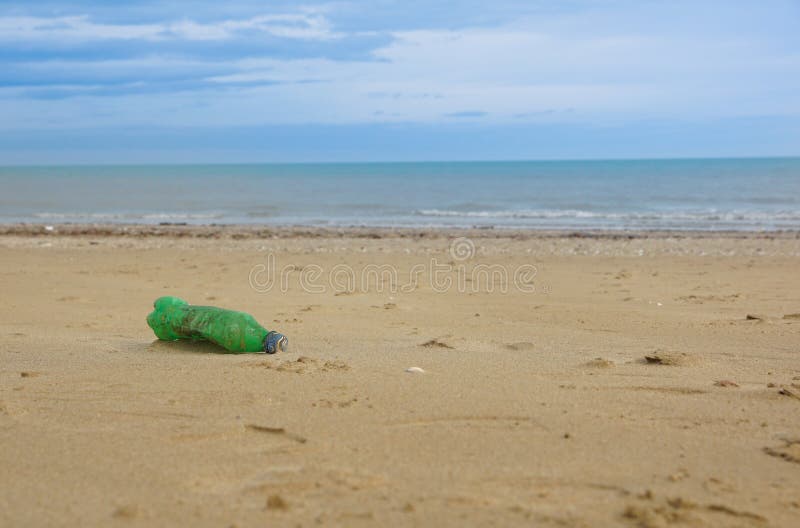 Waste Plastic Bottle on Sand. Garbage on the Beach Stock Photo Image