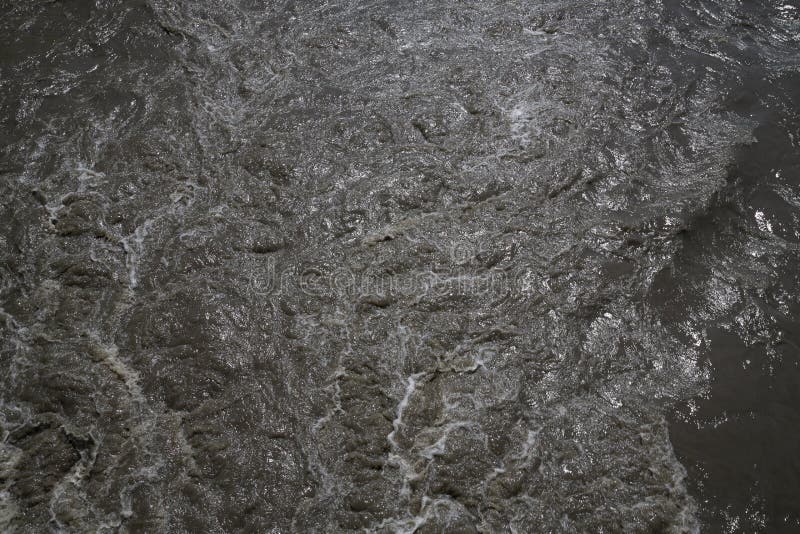 Waste Water Splashing. Mud Dirty Water Brown Water in the River, Sand in the Water Stock Image