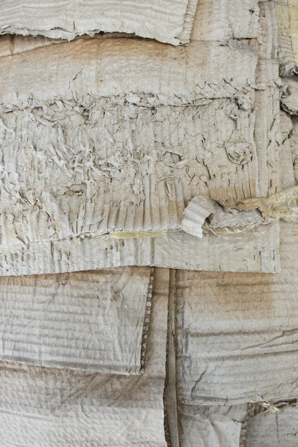 Waste weathered cardboard stack overlapping outside , garbage recycle concept, close up royalty free stock photography
