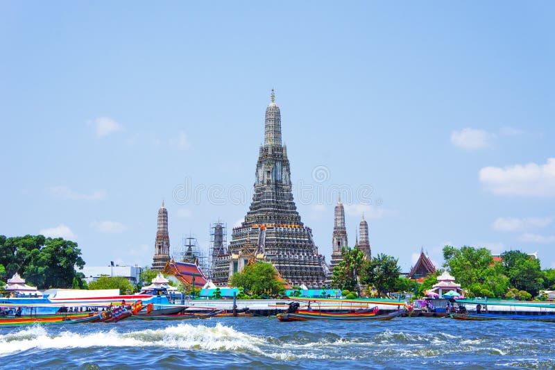 Wat Arun and long tail motor boat cruise on river in Bangkok