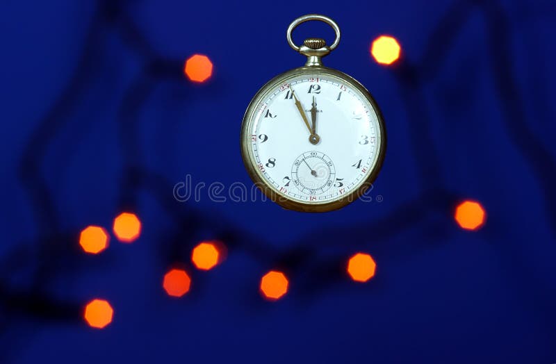 Watch and Christmas lights stock photo. Image of holiday 35790174