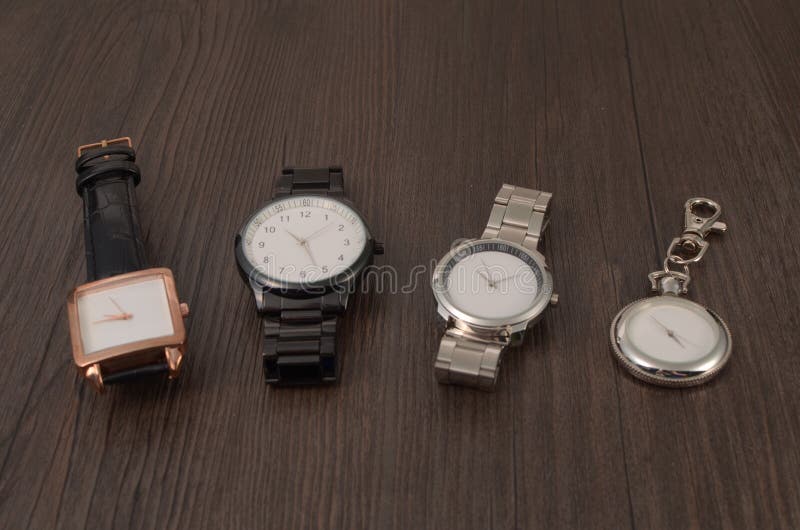 Watch on a wooden floor stock photo. Image of checking - 94208744