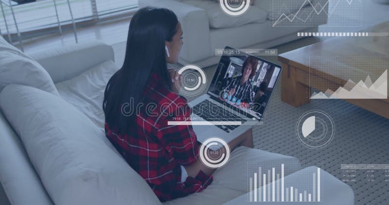 Watching animation with data analytics overlay, woman using laptop in living room stock footage