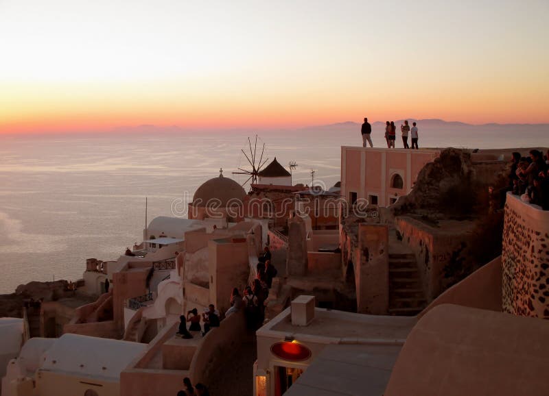 Watching the Famous Oia Sunset at Oia Village on Santorini Island of Greece stock images Watching the Famous Oia Sunset at Oia Village on Santorini Island of Greece stock images