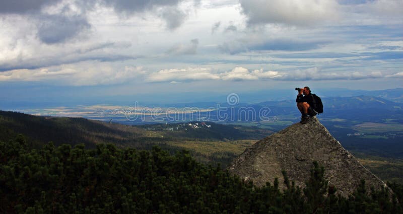 Watching the nature from the top of a peak