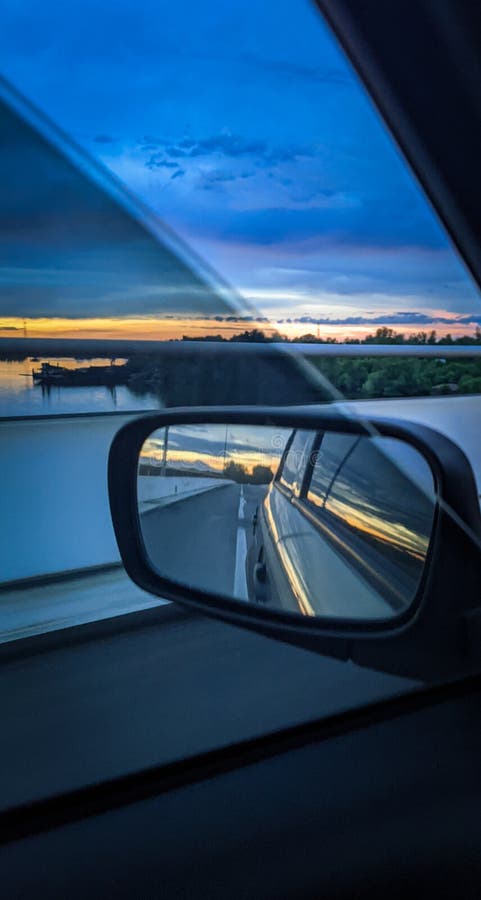 Watching the sunrise through the window of a vehicle and the light of the sunrise royalty free stock photography