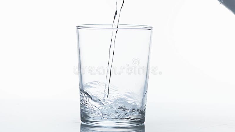 Water being poured into Glass against White Background