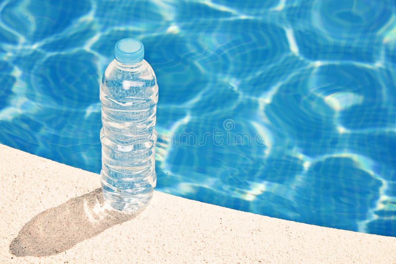 Water Bottle by Swimming Pool Stock Photo - Image of thirst, hydration ...