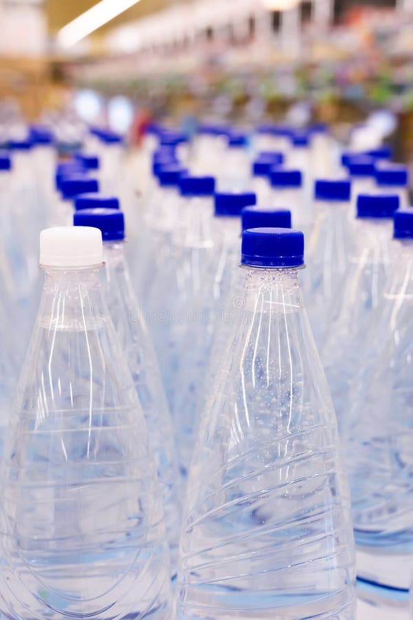 Water Bottles with Blue Caps in Supermarket Stock Image Image of