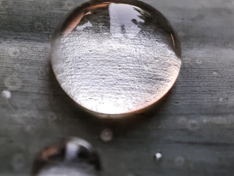 Water bubble on the gray color background and beautiful water drops. Black and white color water bubble on the gray background and beautiful water drops