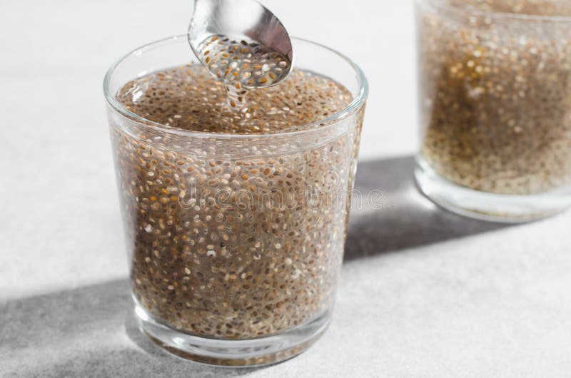 Water with Chia Seeds, Healthy Drink on Bright Background Stock Photo