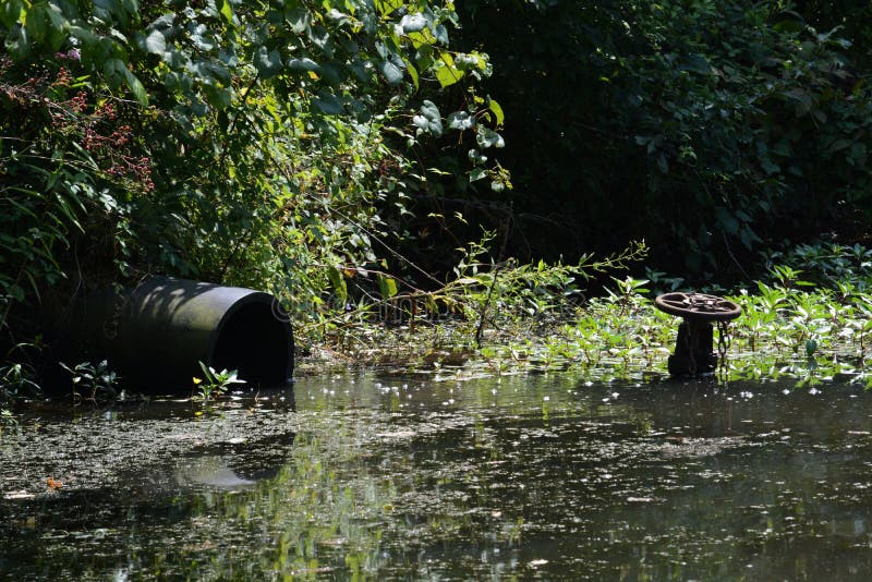 Water discharge pipe and control valve royalty free stock photo