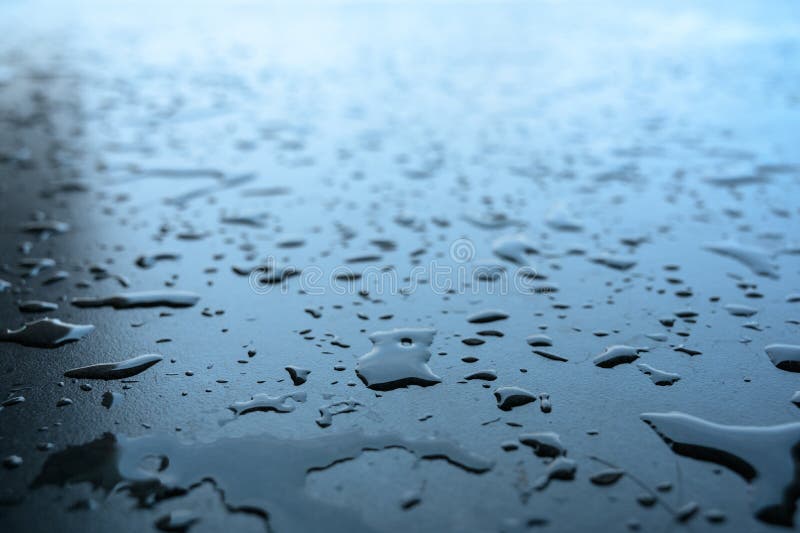 Water Drop on the Black Ceramic Tile Floor after Taking a Bath Stock