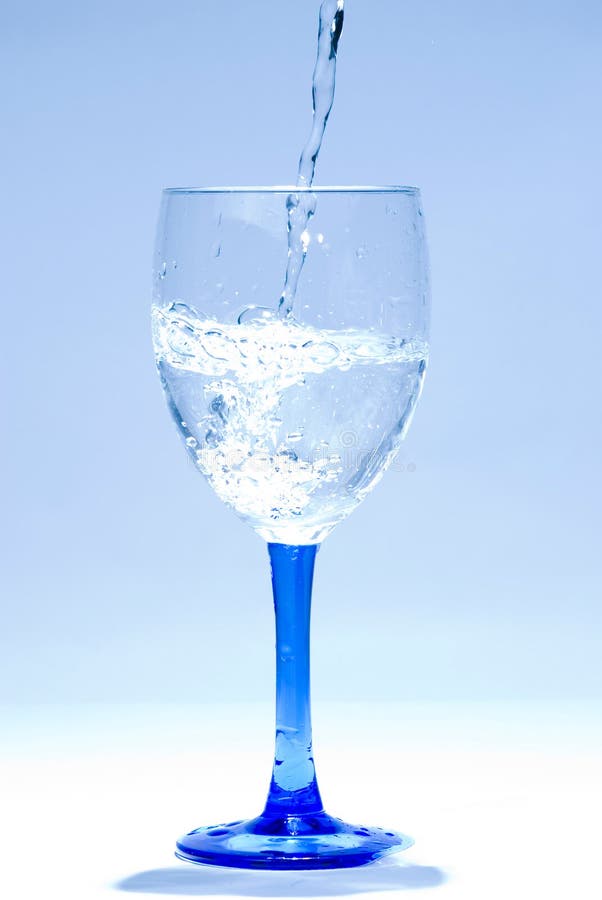 Water drop into glass stock photo. Image of flowing, blue 10556094