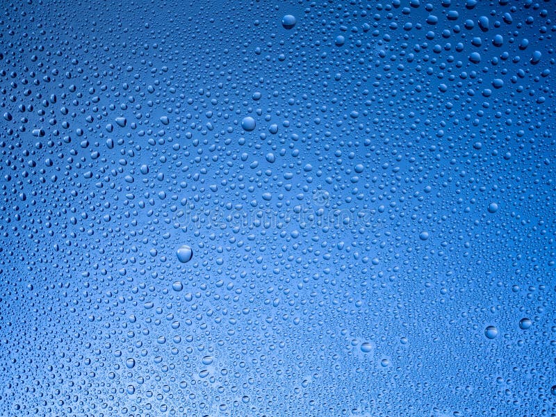 Water droplets on the glass with a colored background.