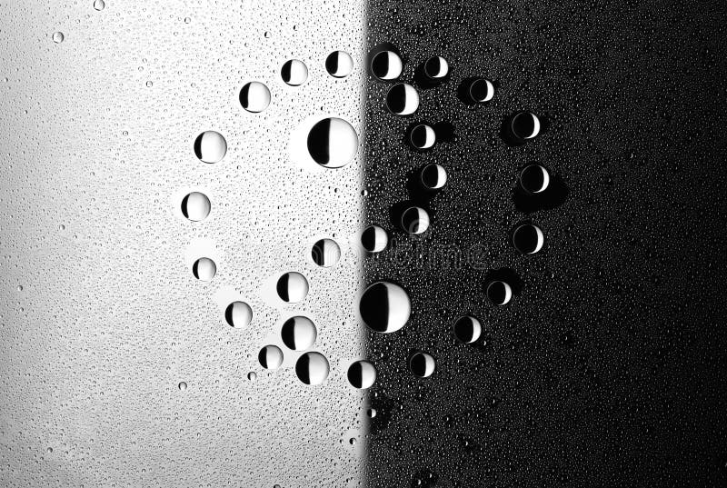 Water droplets on glass. Yin and yang.