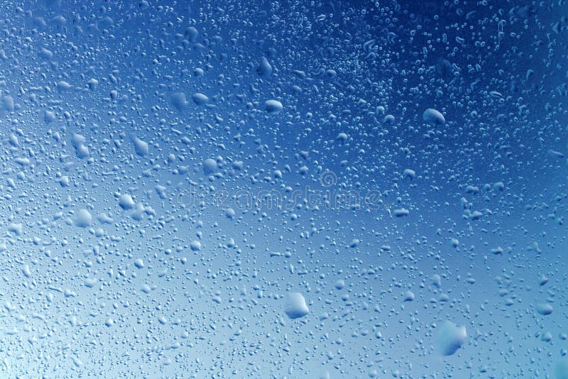 Close up of water droplets on a window. Window color reflection background stock images, royalty-free photos and pictures