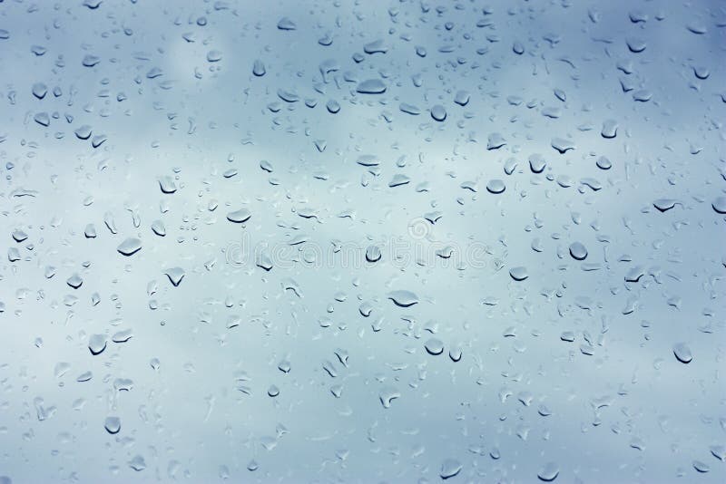 Water drops on metalized car paint, hence the tiny grain-looking dots on the surface