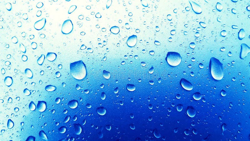 Water Drops background on the Blue glossy surface, Rain droplets royalty free stock image
