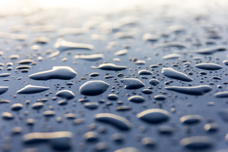 Water drops on black, abstract background stock photos